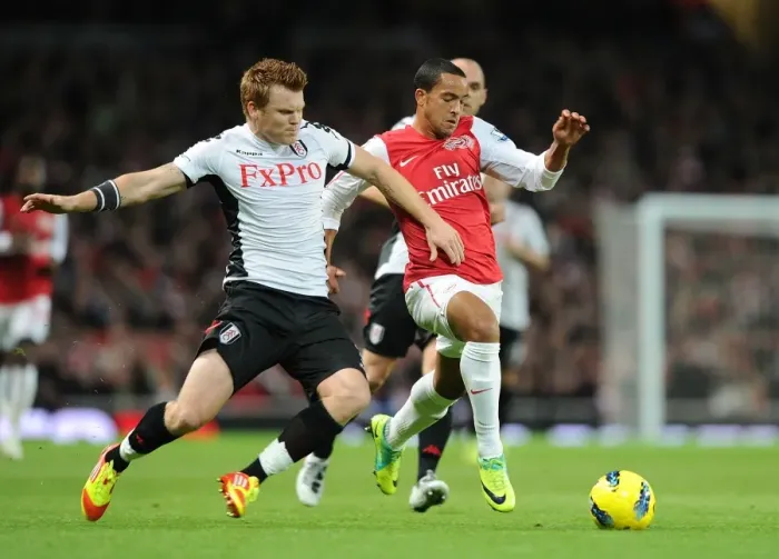 Framed Print : Theo Walcott's Sensational Run Past John Arne Riise: A Flash of Skill and Agility from the Arsenal vs Fulham Match (2011-12)