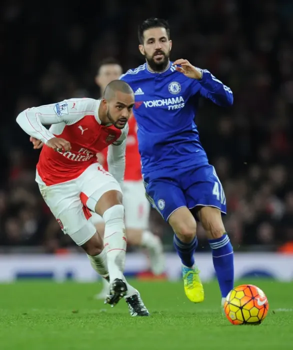 Framed Print : Theo Walcott's Sneaky Move: Outsmarting Cesc Fabregas in the Arsenal vs. Chelsea Clash, 2015-16