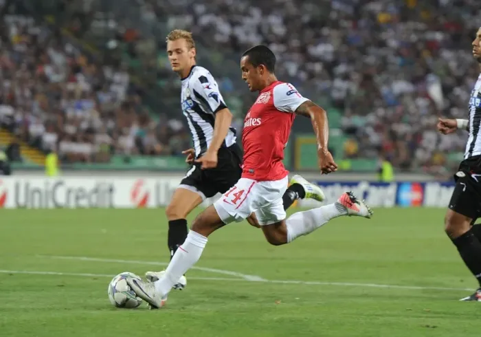 Framed Print : Theo Walcott's Strike: Arsenal's Winning Moment against Udinese in the UEFA Champions League Play-Off (2011) Framed Print : Theo Walcott's Strike: Arsenal's Winning Moment against Udinese in the UEFA Champions League Play-Off (2011)