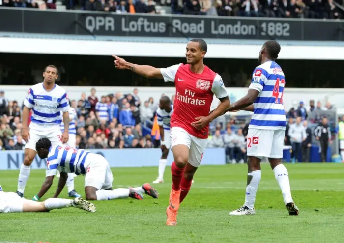 Framed Print : Theo Walcott's Thrilling Goal Celebration: Arsenal's Triumph at Queens Park Rangers, Premier League 2011-12
