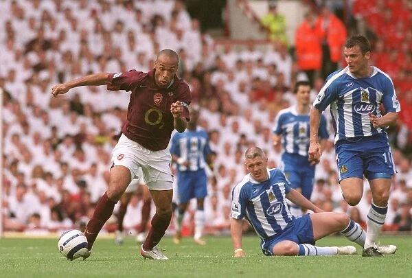 Thierry Henry (Arsenal) Lee McCulloch (Wigan). Arsenal 4:2 Tottenham Hotspur