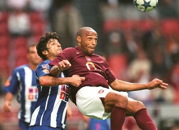 Thierry Henry (Arsenal) and Pedro Emmaunel (Porto). Arsenal 2:1 Porto