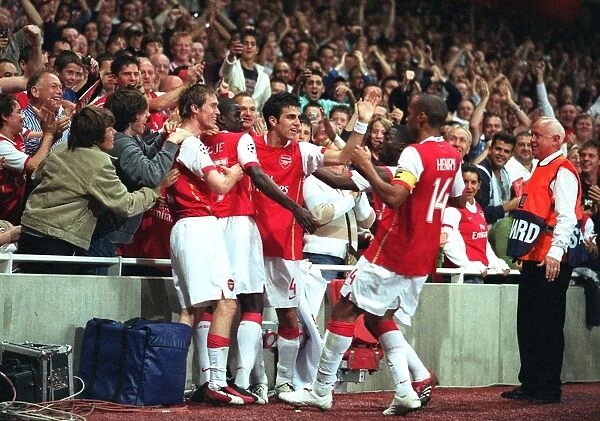 Thierry Henry celebrates scoring Arsenals 1st goal with Emmanuel Eboue
