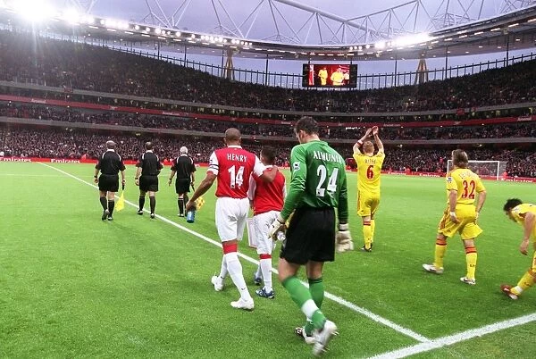 Thierry Henry and Manuel Almunia (Arsenal) walk out onto the pitch