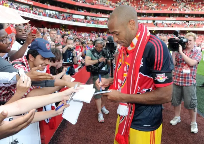 Framed Print : Thierry Henry (Red Bulls) signs autographs for the fans at the end of the match