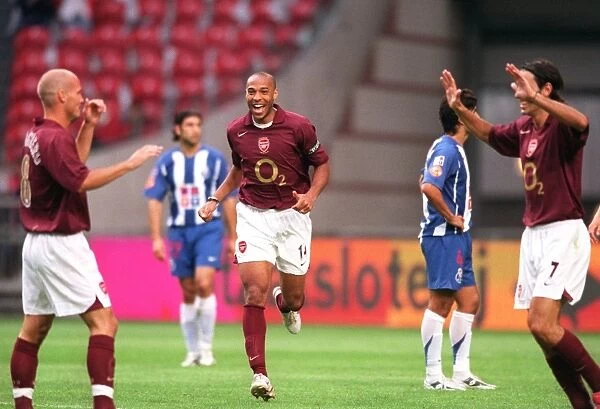 Thierry Henry and Robert Pires Celebrate Freddie Ljungberg's Goal: Arsenal's Victory at Amsterdam Tournament vs Porto (2005)