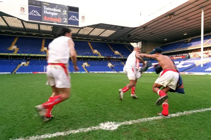 Framed Print : Thierry Henry runs off with the inflatable trophy followed by Robert Pires Framed Print : Thierry Henry runs off with the inflatable trophy followed by Robert Pires