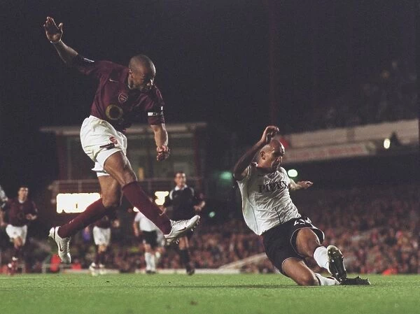 Thierry Henry scores Arsenals 2nd goal past Zesh Rehman (Fulham)
