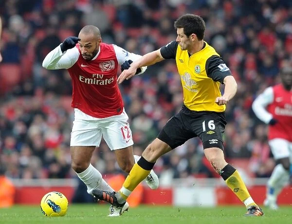 Thierry Henry vs Scott Dann: Intense Battle at Arsenal's Emirates Stadium (Arsenal v Blackburn Rovers 2011-12)