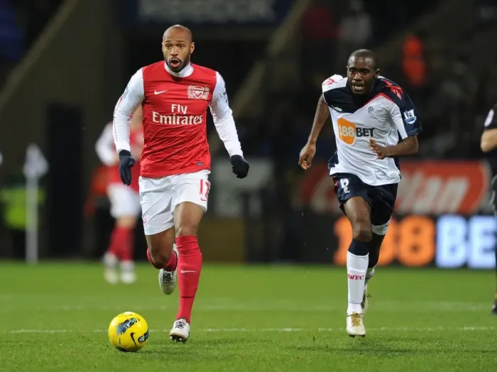 Framed Print : Thierry Henry's Agile Outmaneuver of Fabrice Muamba: A Premier League Legend's Moment, 2012