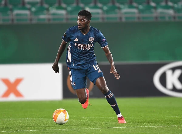 Thomas Partey in Action: Arsenal's Midfield Maestro Shines in Europa League Clash against Rapid Vienna