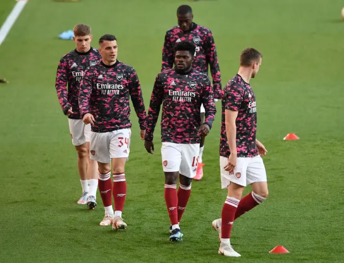 Framed Print : Thomas Partey Alone: Empty Seats of Arsenal's Emirates Stadium in UEFA Europa League Semi-Final vs Villarreal