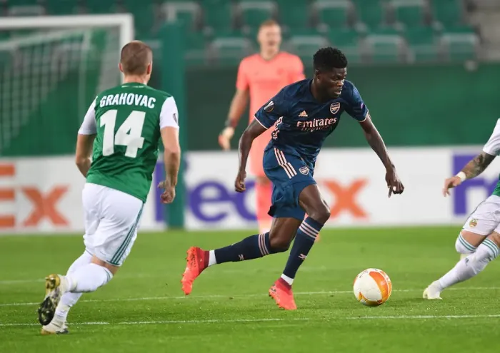 Framed Print : Thomas Partey Breaks Past Rapid Wien's Defense in Arsenal's Europa League Clash Framed Print : Thomas Partey Breaks Past Rapid Wien's Defense in Arsenal's Europa League Clash