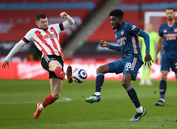 Framed Print : Thomas Partey Faces Off Against Oliver Burke: Sheffield United vs. Arsenal, Premier League 2020-21 Framed Print : Thomas Partey Faces Off Against Oliver Burke: Sheffield United vs. Arsenal, Premier League 2020-21
