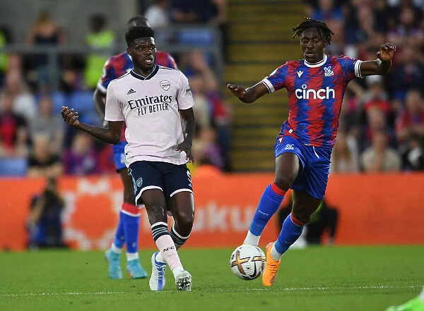 Thomas Partey Faces Pressure from Eberechi Eze in Crystal Palace vs Arsenal Premier League Clash (2022-23)