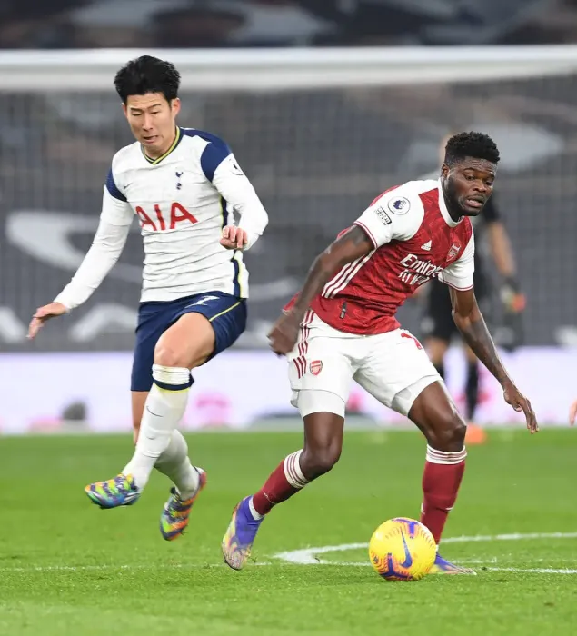 Framed Print : Thomas Partey Outsmarts Son Heung-Min: Arsenal's Triumph Over Tottenham in the Premier League 2020-21 Battle at Tottenham Hotspur Stadium Framed Print : Thomas Partey Outsmarts Son Heung-Min: Arsenal's Triumph Over Tottenham in the Premier League 2020-21 Battle at Tottenham Hotspur Stadium