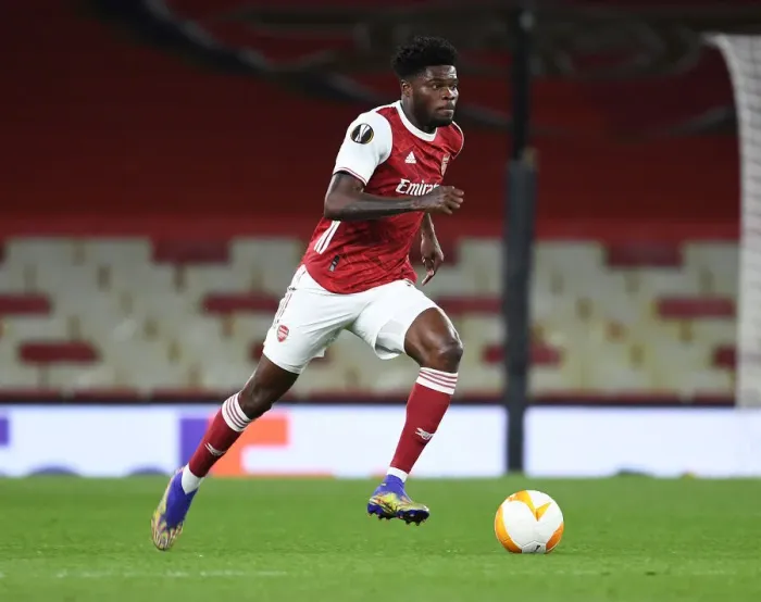 Framed Print : Thomas Partey: The Solo Warrior in Empty Emirates Stadium - Arsenal's UEFA Europa League Battle Framed Print : Thomas Partey: The Solo Warrior in Empty Emirates Stadium - Arsenal's UEFA Europa League Battle