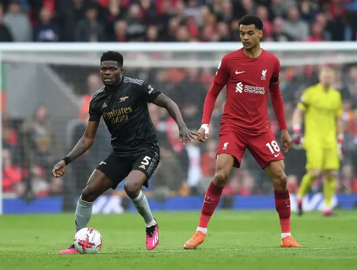 Framed Print : Thomas Partey vs. Cody Gakpo: A Premier League Battle at Anfield