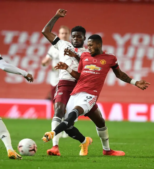 Framed Print : Thomas Partey vs Fred: A Battle in Empty Old Trafford - Premier League 2020-21: Arsenal's Midfield Clash Framed Print : Thomas Partey vs Fred: A Battle in Empty Old Trafford - Premier League 2020-21: Arsenal's Midfield Clash