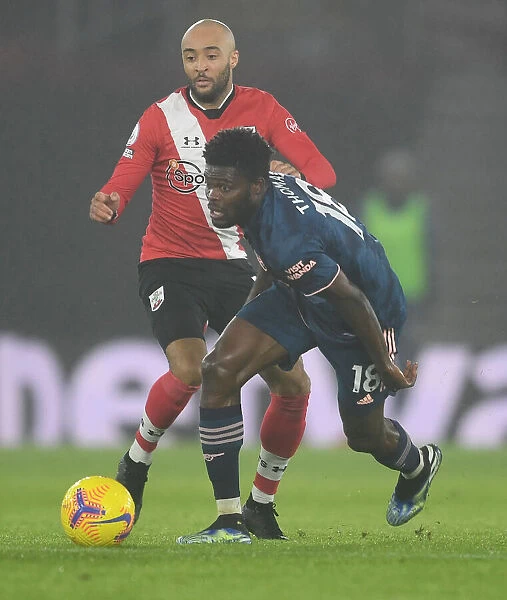 Thomas Partey vs. Nathan Redmond: A Battle in Empty St. Mary's Stadium - Arsenal's Midfield Clash with Southampton, Premier League 2021