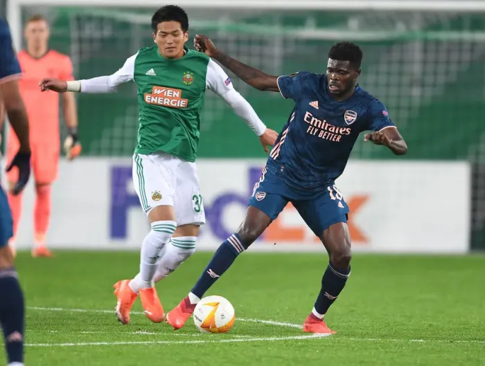 Framed Print : Thomas Partey's Europa League Breakthrough: Surging Past Rapid Wien's Koya Kitagawa