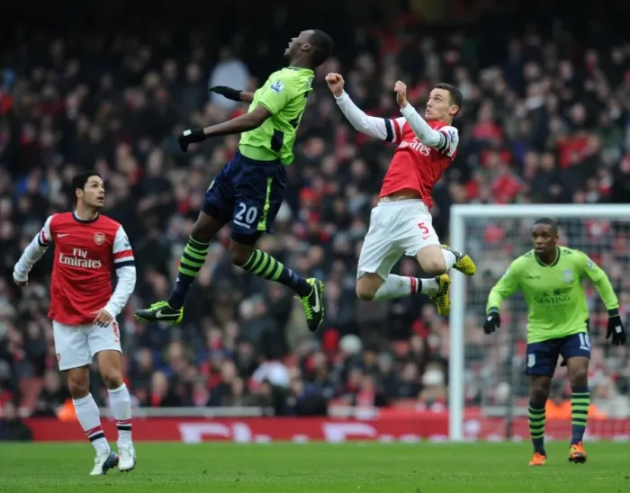 Framed Print : Thomas Vermaelen (Arsenal) Christian Benteke (Villa). Arsenal 2: 1 Aston Villa. Barclays Framed Print : Thomas Vermaelen (Arsenal) Christian Benteke (Villa). Arsenal 2: 1 Aston Villa. Barclays