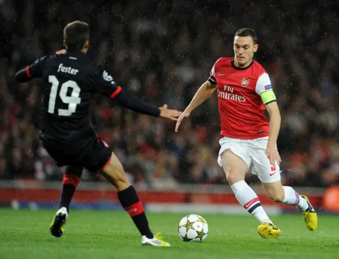 Framed Print : Thomas Vermaelen (Arsenal) David Fuster (Olympiacos). Arsenal 3: 1 Olympiacos