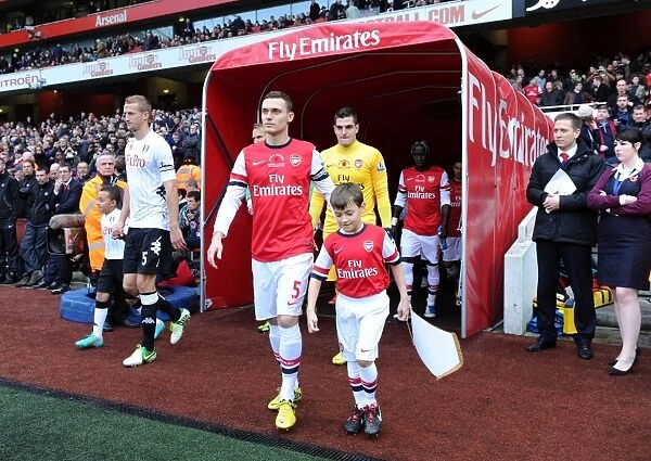 Thomas Vermaelen (Arsenal) leads out the team. Arsenal 3:3 Fulham. Barclays Premier League