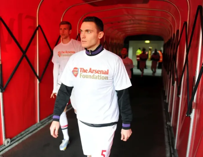 Framed Print : Thomas Vermaelen (Arsenal) walks out to warm up in his Arsenal Foundation t shirt Framed Print : Thomas Vermaelen (Arsenal) walks out to warm up in his Arsenal Foundation t shirt
