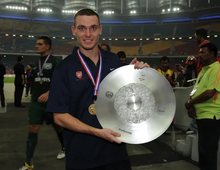 Framed Print : Thomas Vermaelen (Arsenal) with the winners trophy after the match. Malaysia XI 0: 4 Arsenal