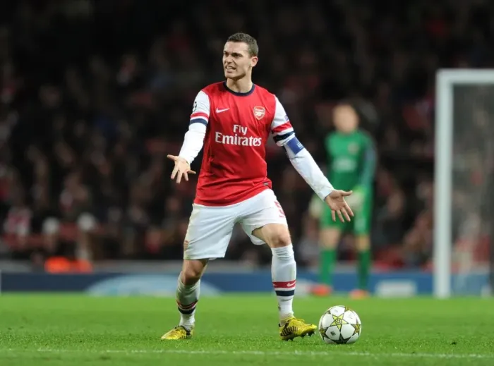 Framed Print : Thomas Vermaelen: Arsenal's Defensive Powerhouse in Action against Montpellier, UEFA Champions League 2012-13