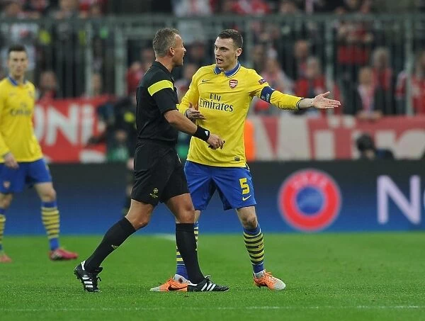 Thomas Vermaelen Confronts Referee Svein Oddvar Moen in Tense Arsenal-Bayern Clash