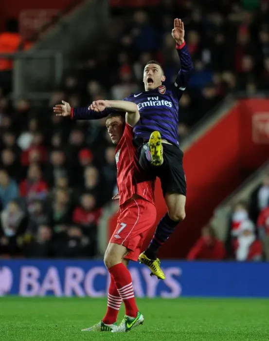 Framed Print : Thomas Vermaelen Leaps Above Rickie Lambert: Southampton vs. Arsenal, Premier League 2012-13 Framed Print : Thomas Vermaelen Leaps Above Rickie Lambert: Southampton vs. Arsenal, Premier League 2012-13