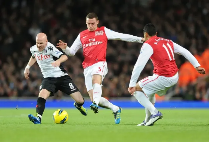 Framed Print : Thomas Vermaelen vs. Andy Johnson: A Battle at the Emirates (Arsenal v Fulham, 2011-12)