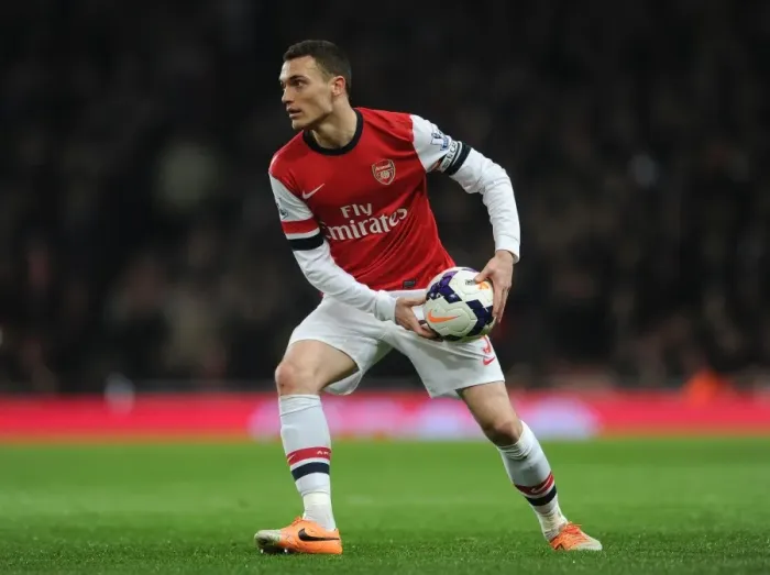 Framed Print : Thomas Vermaelen's Determination: Arsenal's Clash with Swansea City (2013-14)