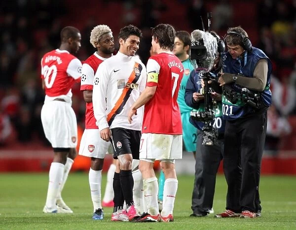 Tomas Rosicky (Arsenal) with Eduardo (Shaktar) the former Arsenal player after the match