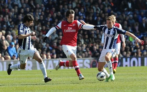 Tomas Rosicky Battles Past Claudio Yacob and James Morrison in Arsenal's Premier League Clash with West Bromwich Albion