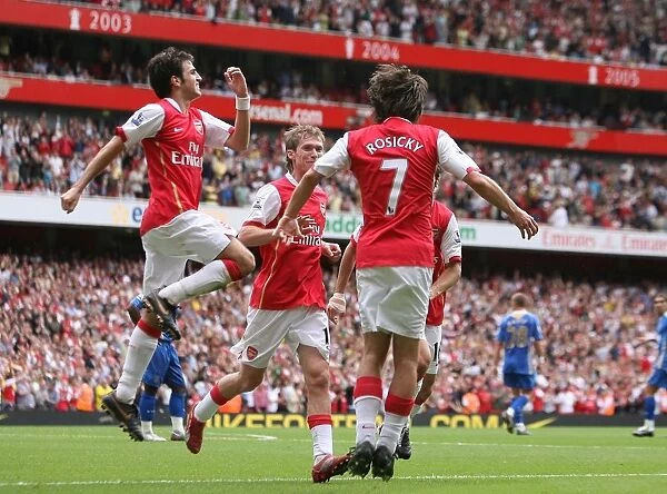 Tomas Rosicky celebrates scoring Arsenals 3rd goal with Cesc Fabregas and Alex Hleb
