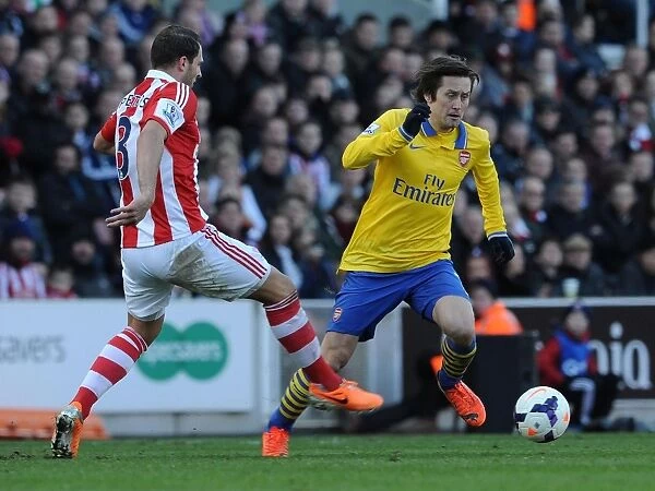 Tomas Rosicky Outmaneuvers Erik Pieters: A Moment from the Stoke City vs. Arsenal Premier League Clash