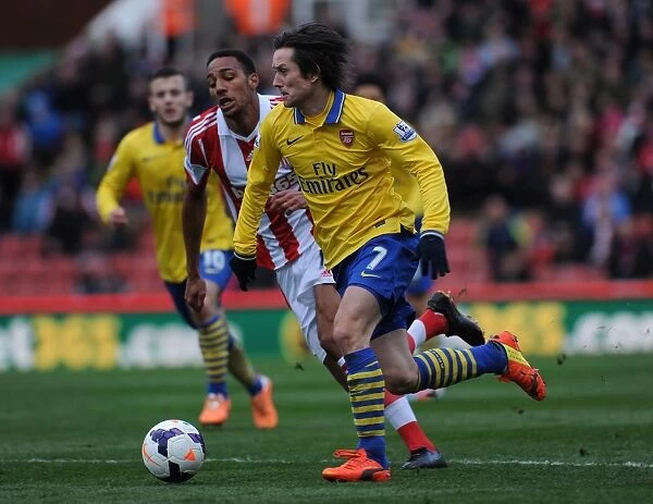 Tomas Rosicky Outmaneuvers Steven Nzonzi: A Moment from the Stoke City vs. Arsenal Premier League Clash (2013-14)