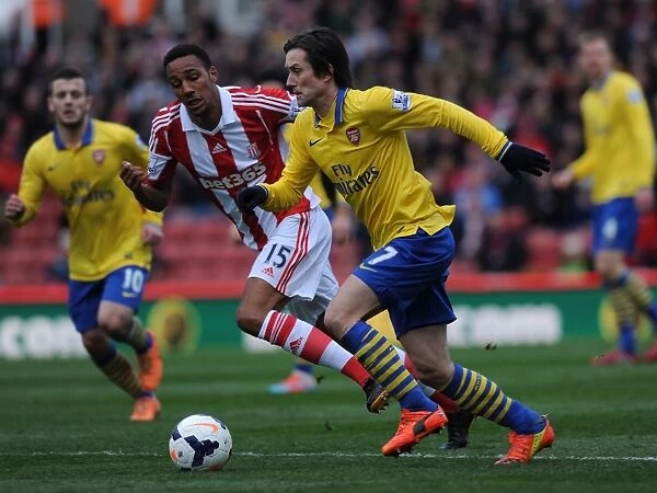 Tomas Rosicky's Pivotal Outmaneuver of Steven Nzonzi: A Game-Changing Moment in the Stoke City vs. Arsenal Premier League Clash (2013-14)