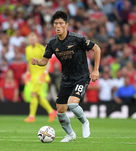 Tomiyasu Stands Firm: Arsenal's Defensive Hero at Old Trafford vs. Manchester United (2022-23 Premier League)