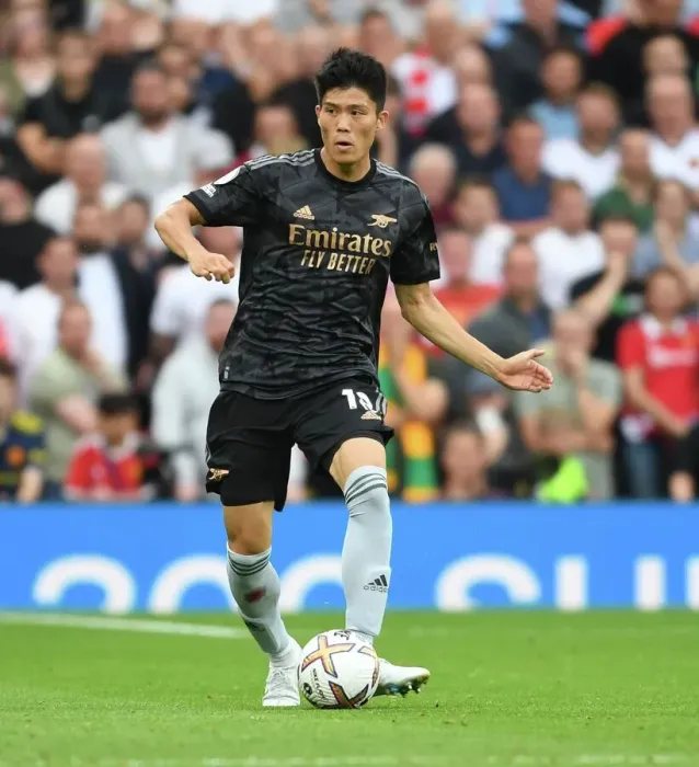 Framed Print : Tomiyasu Stands Firm Against Manchester United at Old Trafford (2022-23 Premier League)