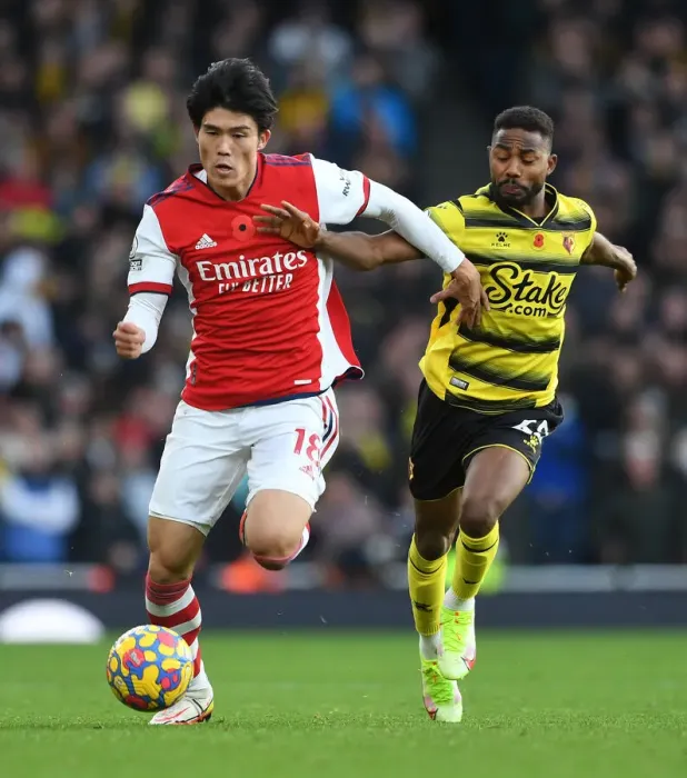 Framed Print : Tomiyasu vs. Dennis: A Premier League Showdown at Emirates Stadium Framed Print : Tomiyasu vs. Dennis: A Premier League Showdown at Emirates Stadium