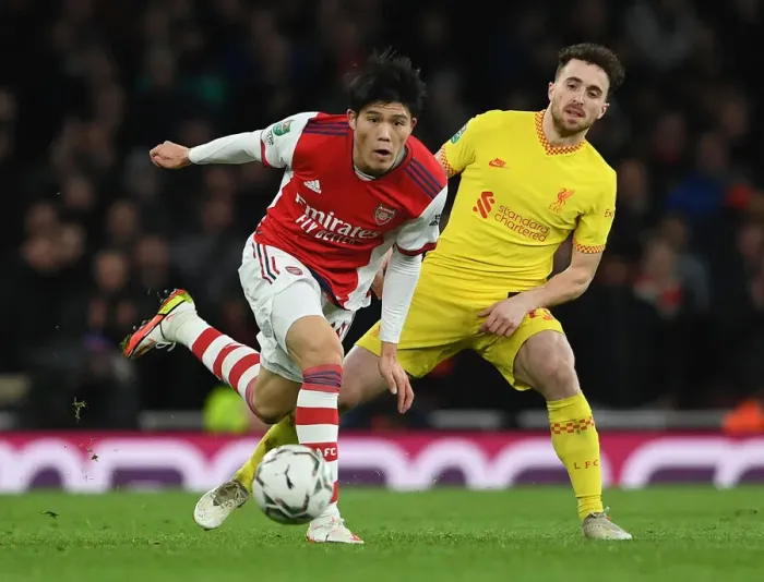 Framed Print : Tomiyasu vs. Jota: Battle in the Carabao Cup Semi-Finals - Arsenal vs. Liverpool Showdown