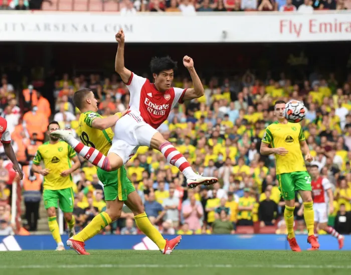 Framed Print : Tomiyasu's Debut Shines: Arsenal's Dominant Win Against Norwich City, Premier League 2021-22