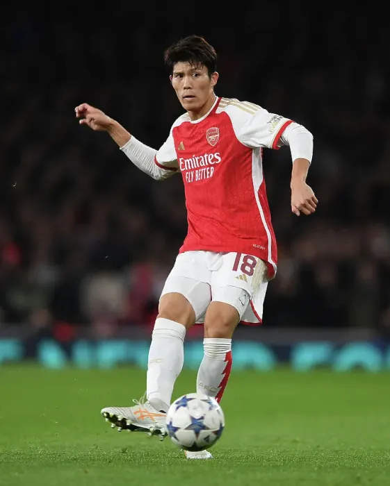 Framed Print : Tomiyasu's Star Performance: Arsenal Triumphs Over Sevilla in Champions League (2023-24)