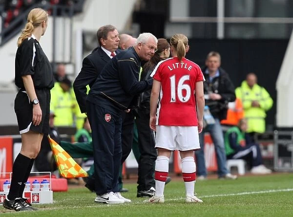 Tony Gervaise the Arsenal Assistant Manager talks to Kim Little