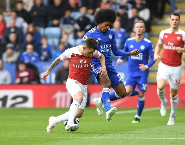 Framed Print : Torreira Takes On Choudhury: Leicester vs. Arsenal, Premier League Showdown