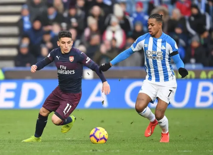 Framed Print : Torreira Tears Through Huddersfield: Arsenal's Lucas Torreira Outmaneuvers Opponent During Premier League Clash